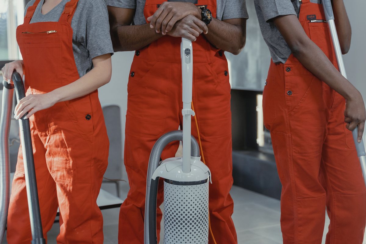 Professional commercial cleaning team preparing equipment