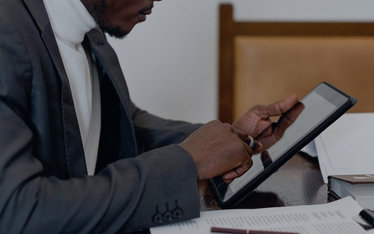 Commercial operations professional reviewing facility information on a tablet